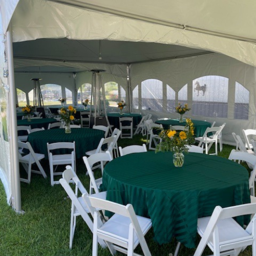 Party / event tents with tables and chairs outside of Boyne Co-Op Hardware and Rental